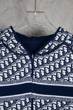 Dior long-sleeve knit sweater close-up, navy crew neck and monogram pattern