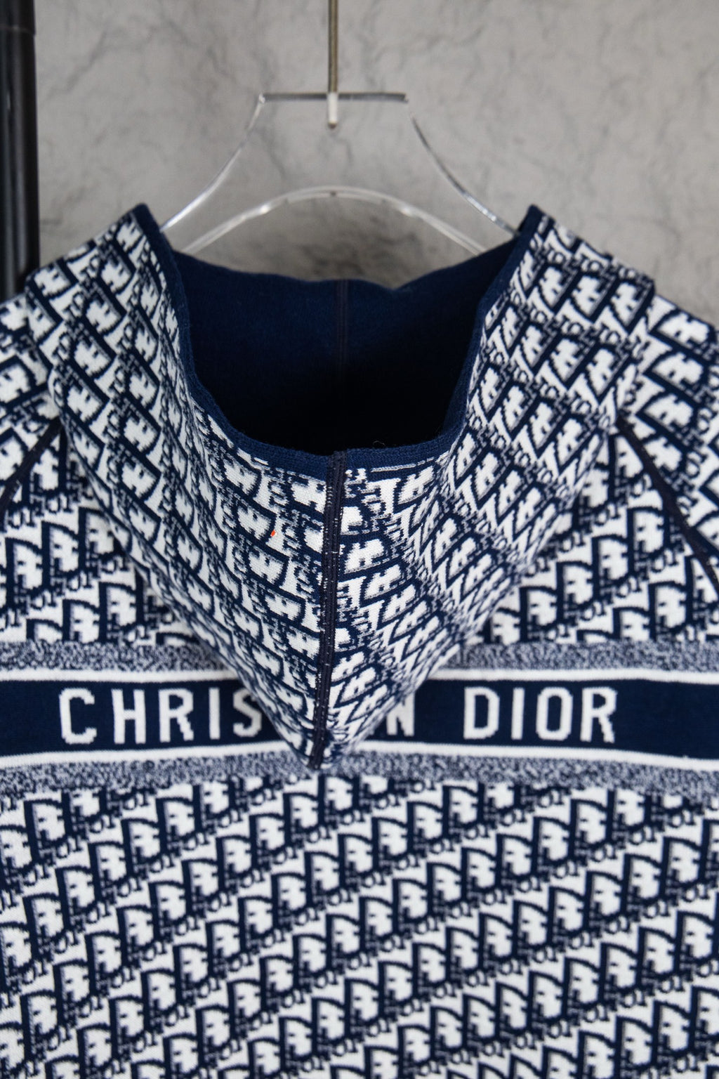 Dior long-sleeve knit sweater front view, navy crew neck and banded monogram design