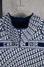 Dior long-sleeve knit sweater front view, navy crew neck and banded monogram design