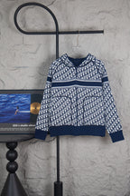 Dior long-sleeve knit sweater with navy and white monogram pattern, ribbed hem