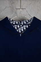 Navy Dior zip-up hoodie close-up at hood opening and front zipper