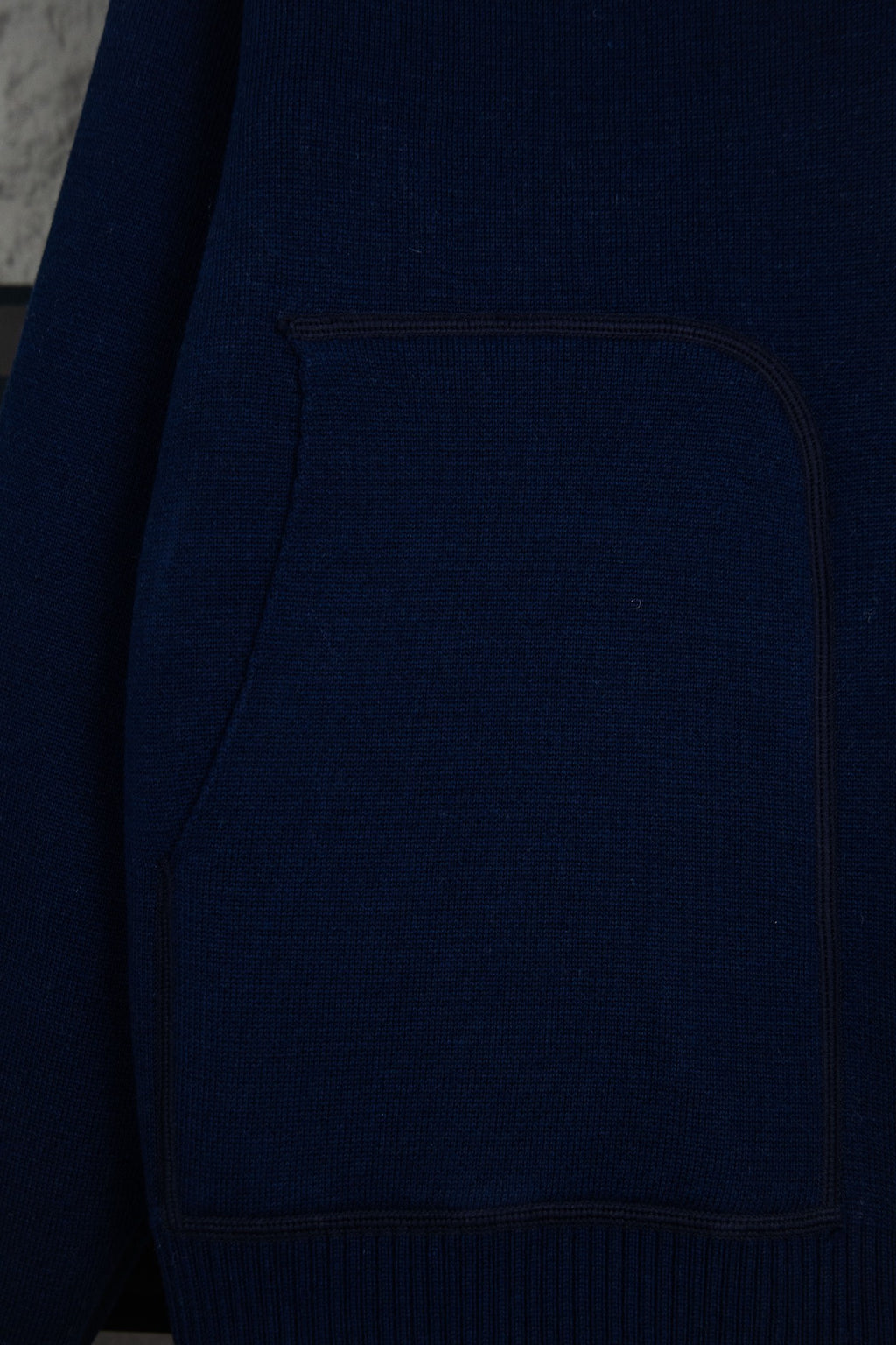 Navy Dior zip-up hoodie front pocket panel with contrast stitching