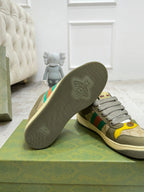 Gucci unisex sneakers with textured rubber outsole; olive upper and multicolor stripes