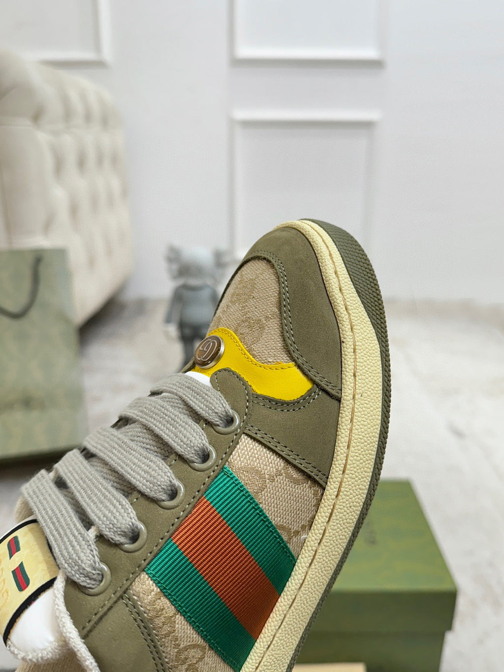 Gucci unisex low-top sneaker with lace-up closure and multicolor stripe on beige-olive upper