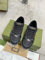 Gucci low-top sneakers in dark gray with multicolor stripe detail and black lace closures