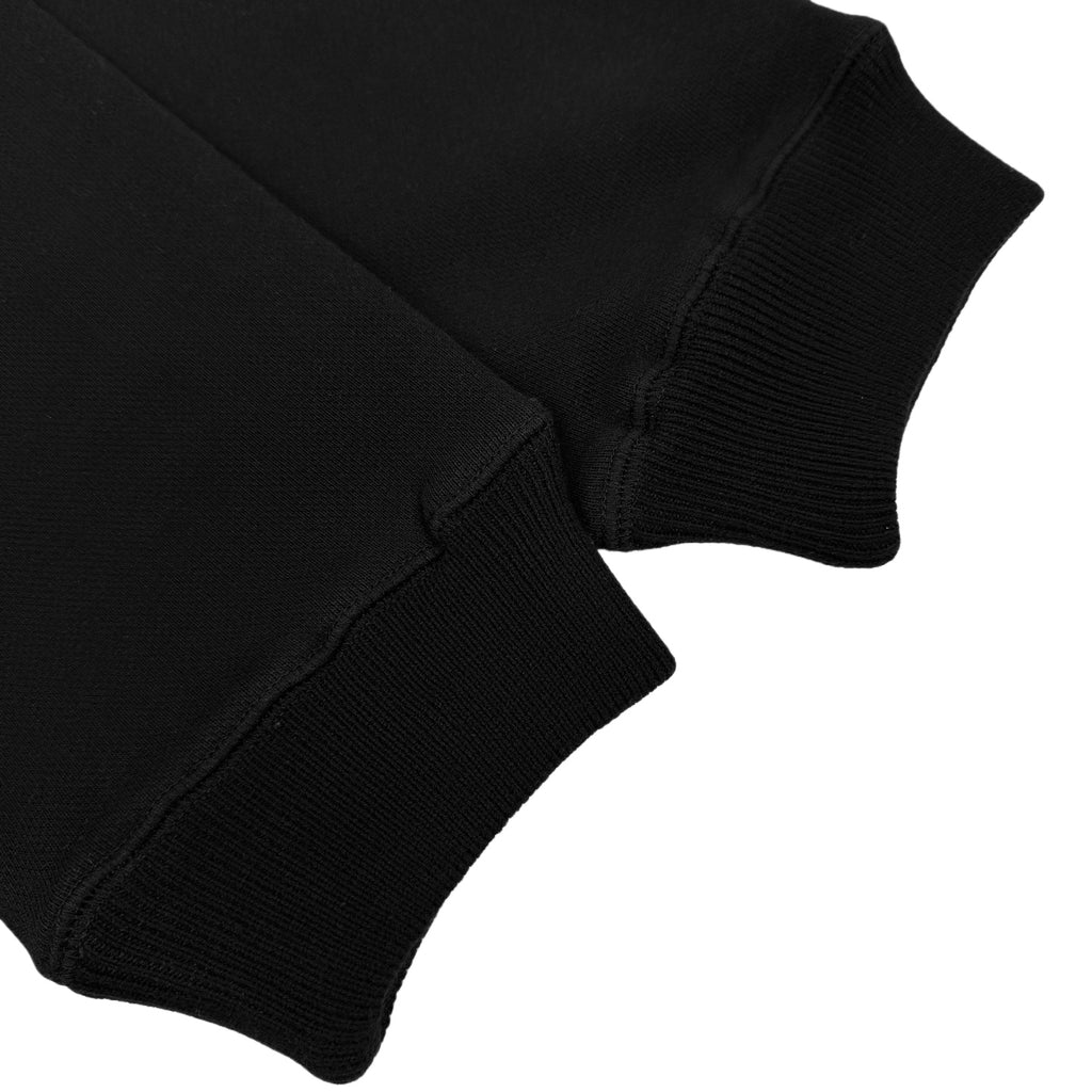 Black hoodie sleeve cuff with ribbed knit hem detail