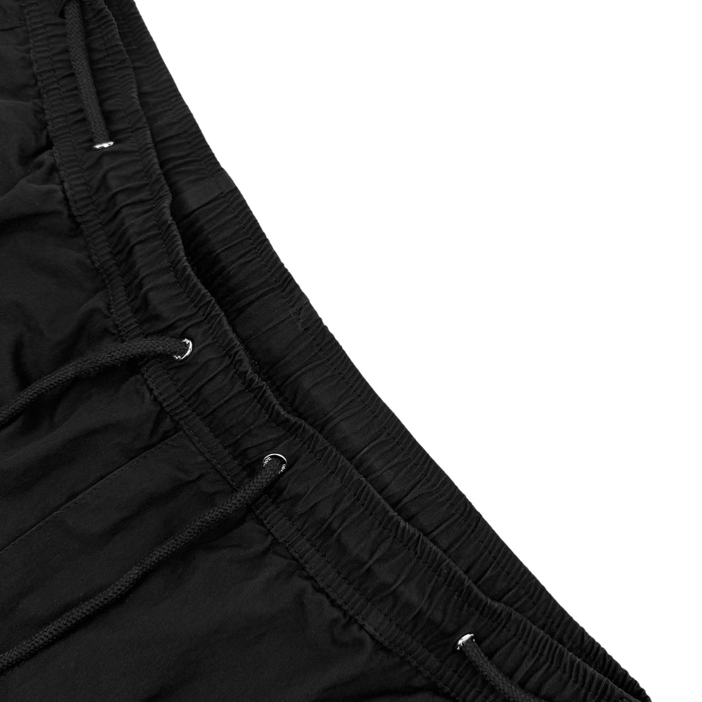 Black pants waistband with ruched elastic and small logo details