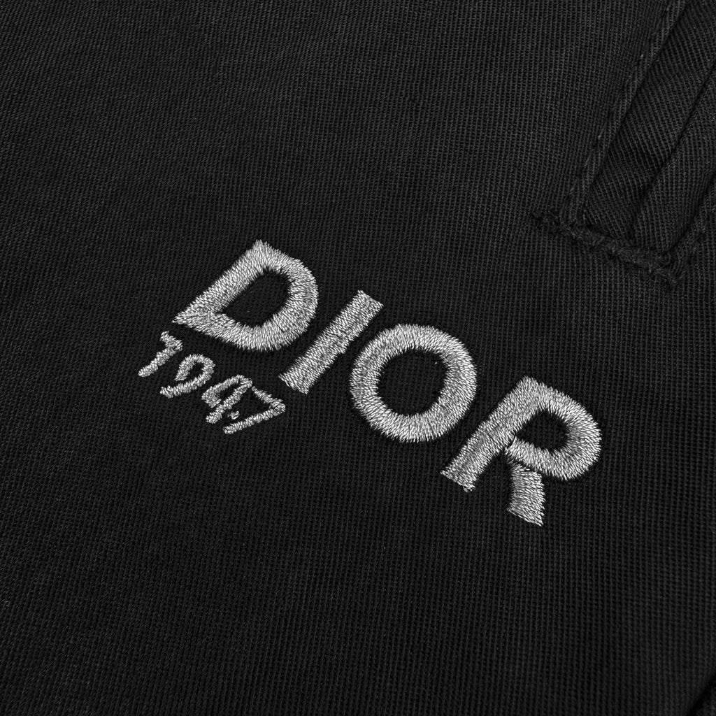 Dior logo embroidery on black fabric