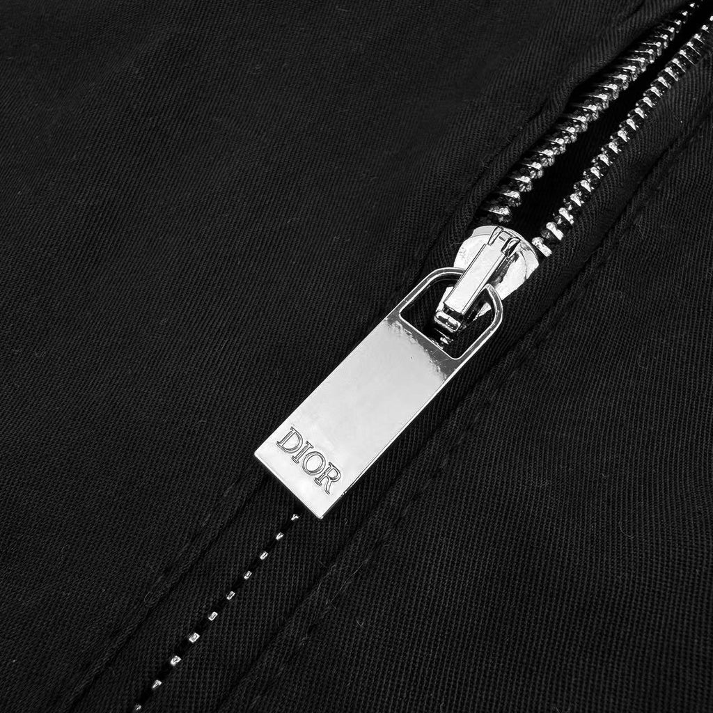Black pants zipper fly with Dior label on metal pull