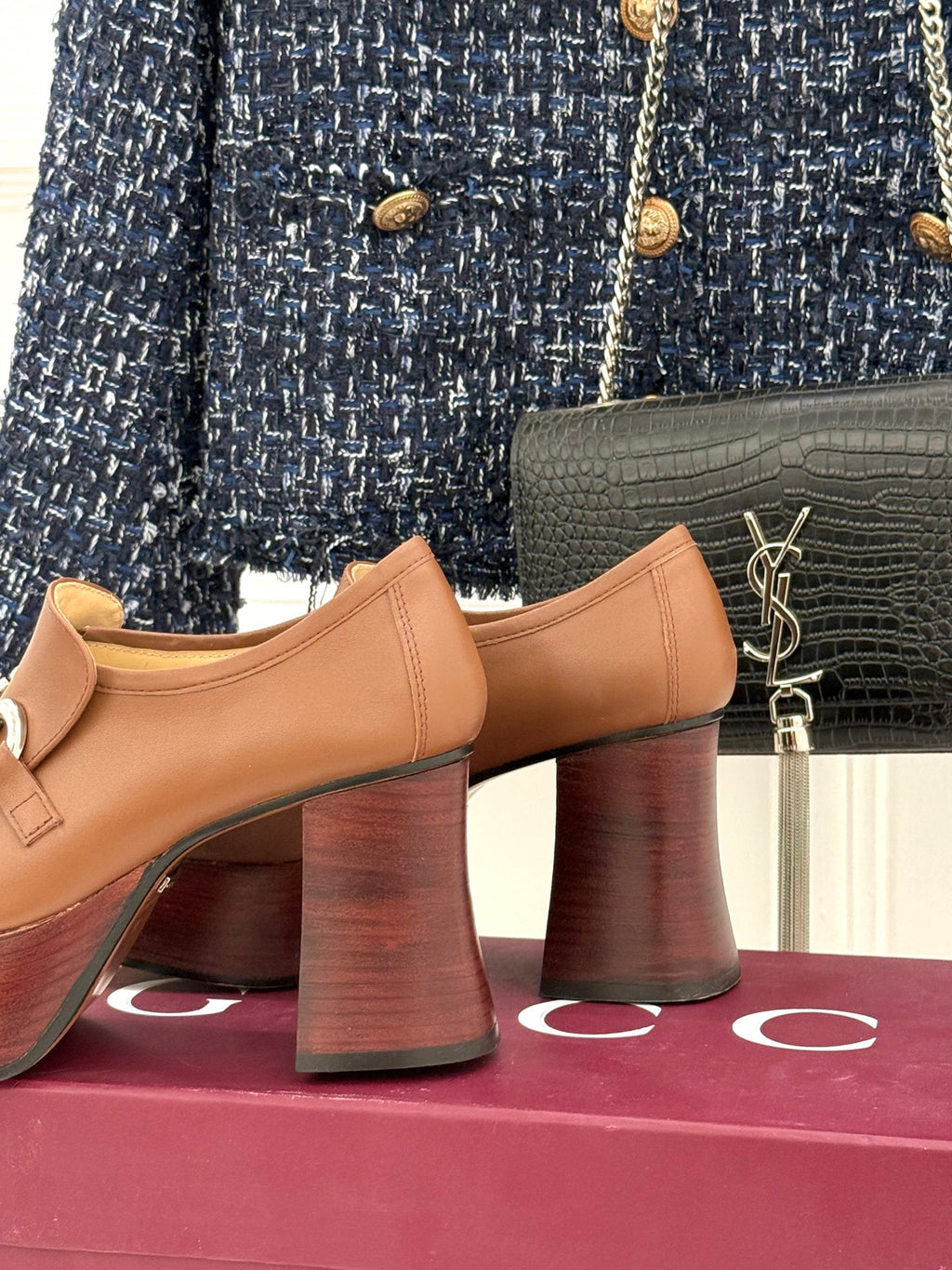 Gucci tan leather loafers side view with silver horsebit bar and stacked block heel