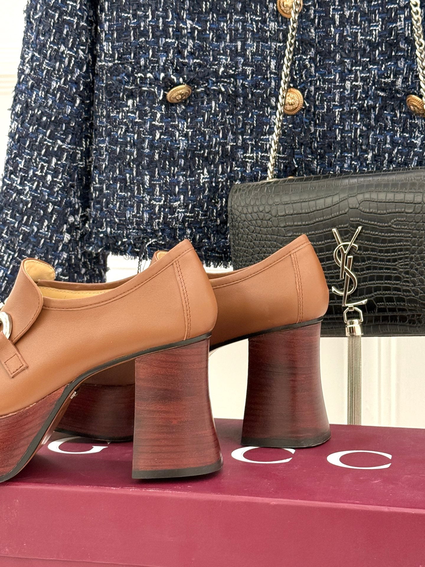 Gucci tan leather loafers side view with silver horsebit bar and stacked block heel