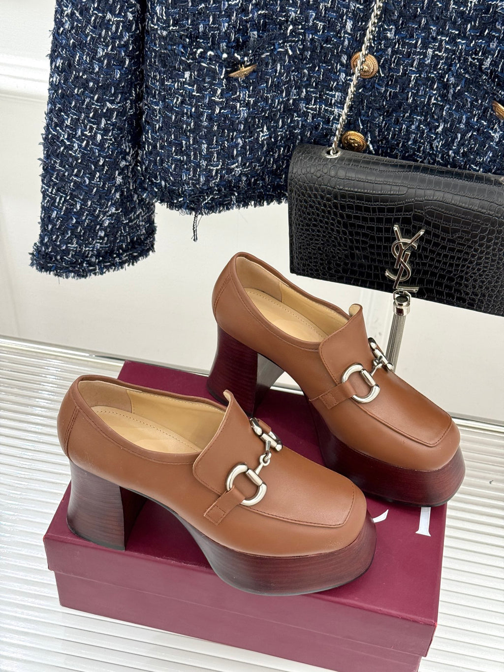Gucci brown leather heeled loafers featuring silver horsebit trim and thick wooden heel
