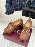 Gucci tan leather loafers with silver horsebit hardware and mid-height block heel