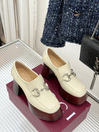 Cream Gucci loafers with metal horsebit bar and dark red block heels
