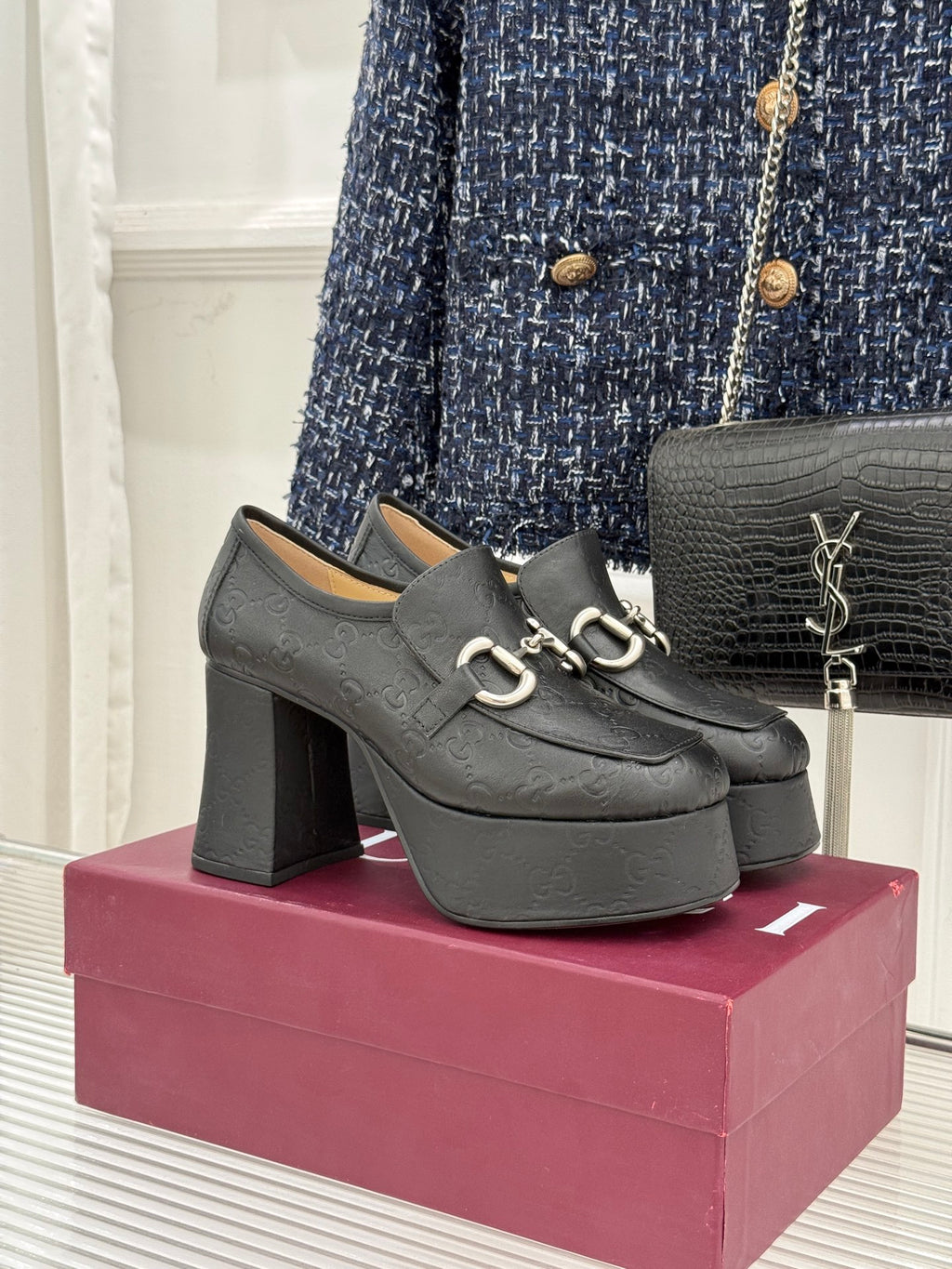 Black Gucci loafer platform heels with gold-tone bit hardware and block heel