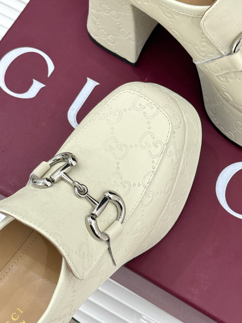Cream embossed leather loafer vamp with silver horsebit detail