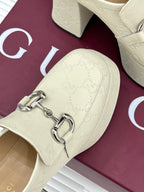 Cream embossed leather loafer vamp with silver horsebit detail