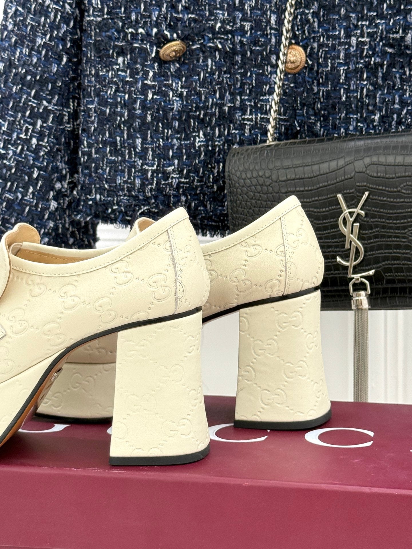 Cream leather loafers with silver horsebit, block heel, back view