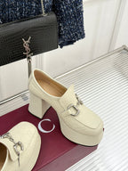 Cream leather loafers with silver horsebit, block heel, angled side view