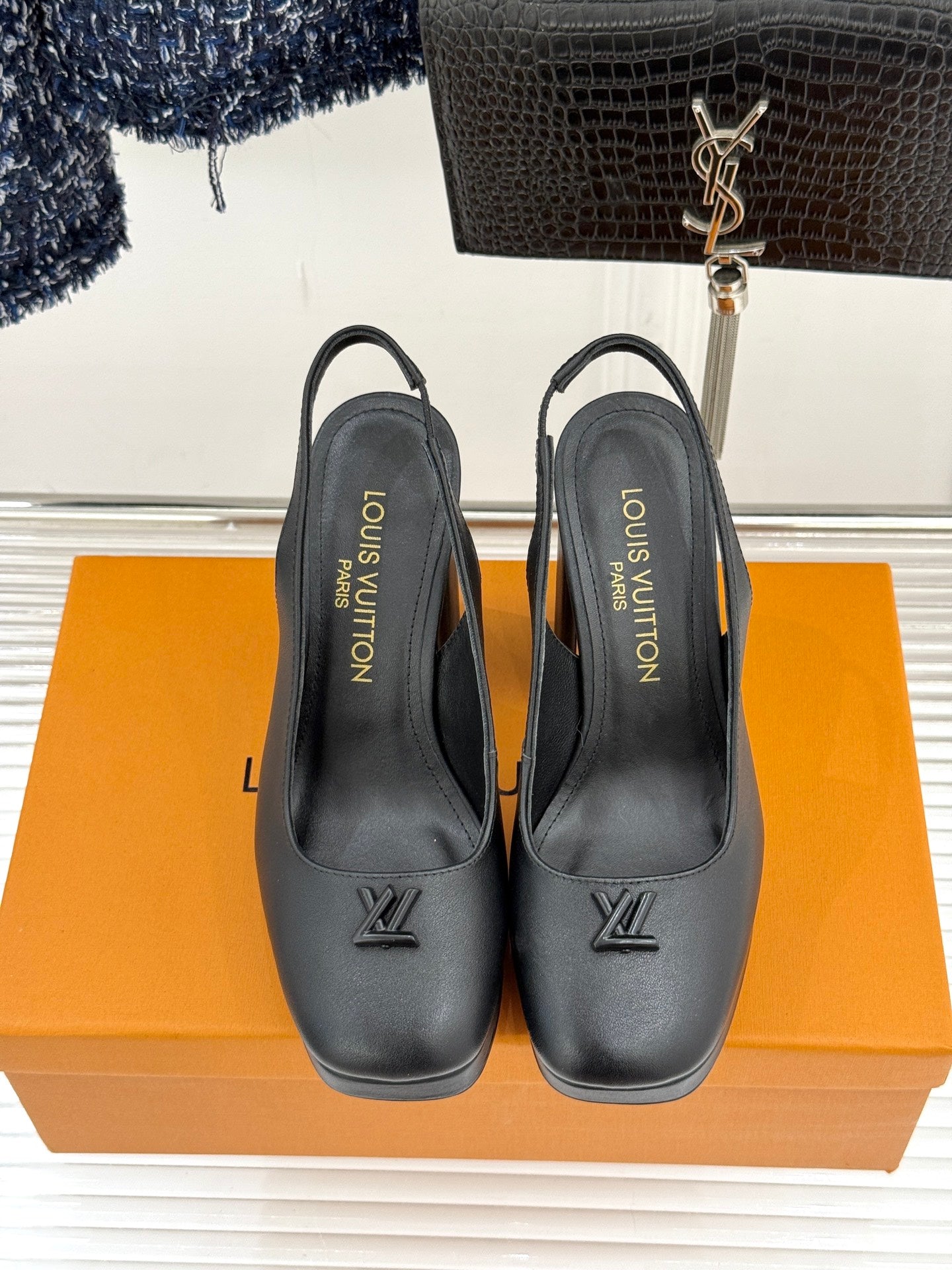 Ladies black platform heels with block heel, LV logo on front, rear angle
