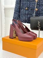 Burgundy leather high-heel pumps with monogram detail and stacked block heel