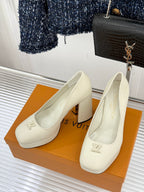 Louis Vuitton cream leather high-heel pumps, LV logo detail on round-toe front