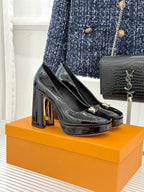Louis Vuitton black patent high-heel pumps with gold LV monogram on the toe