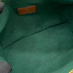 Gucci bag interior lining in green fabric with small leather brand label