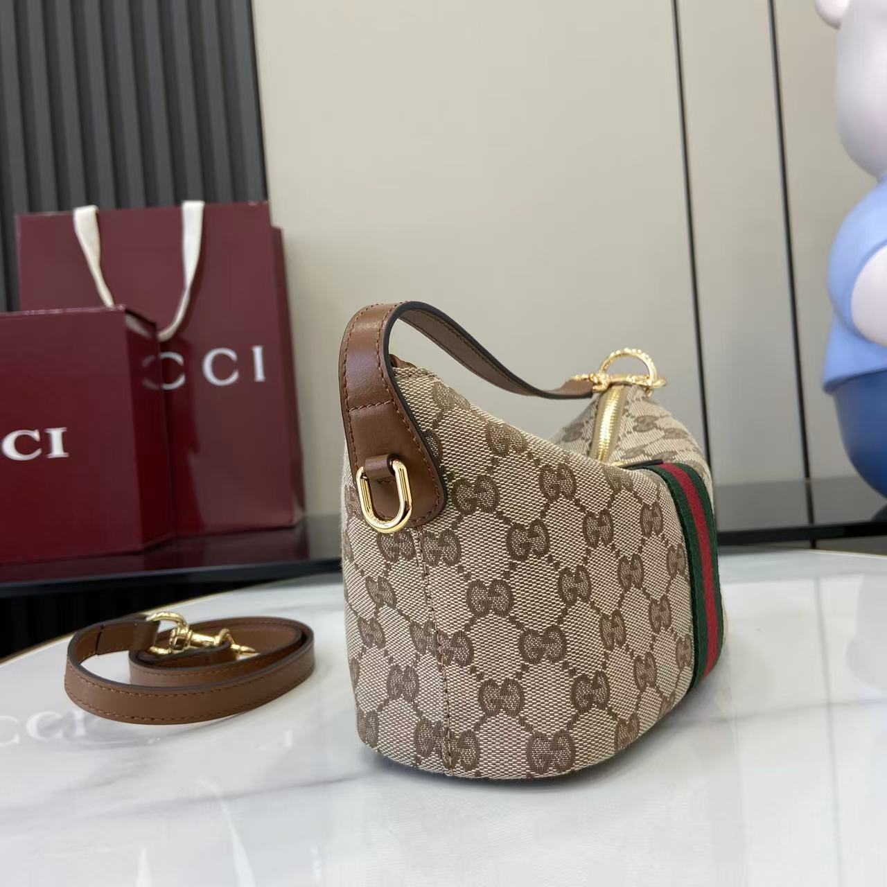 Gucci monogram shoulder bag in beige canvas with web stripe and gold hardware