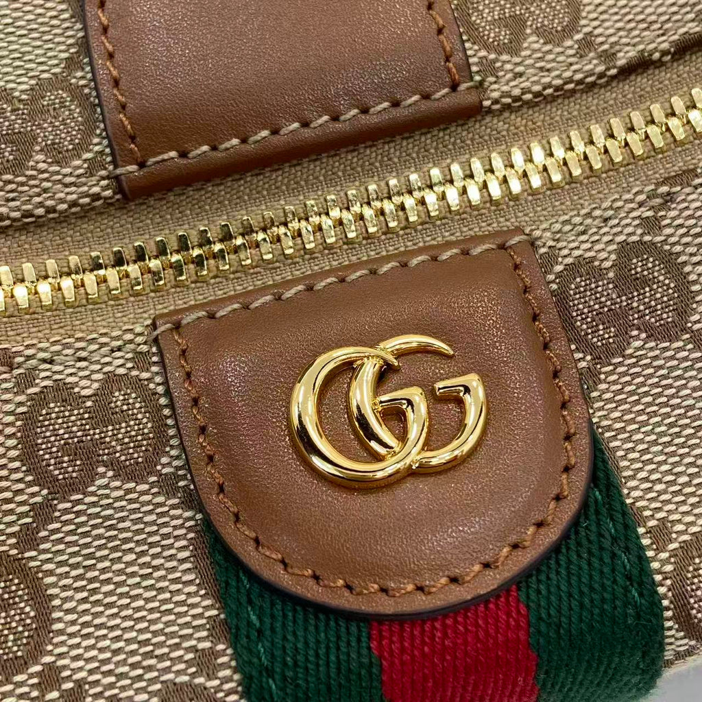 Gucci monogram bag close-up: brown leather patch with GG logo and web stripe