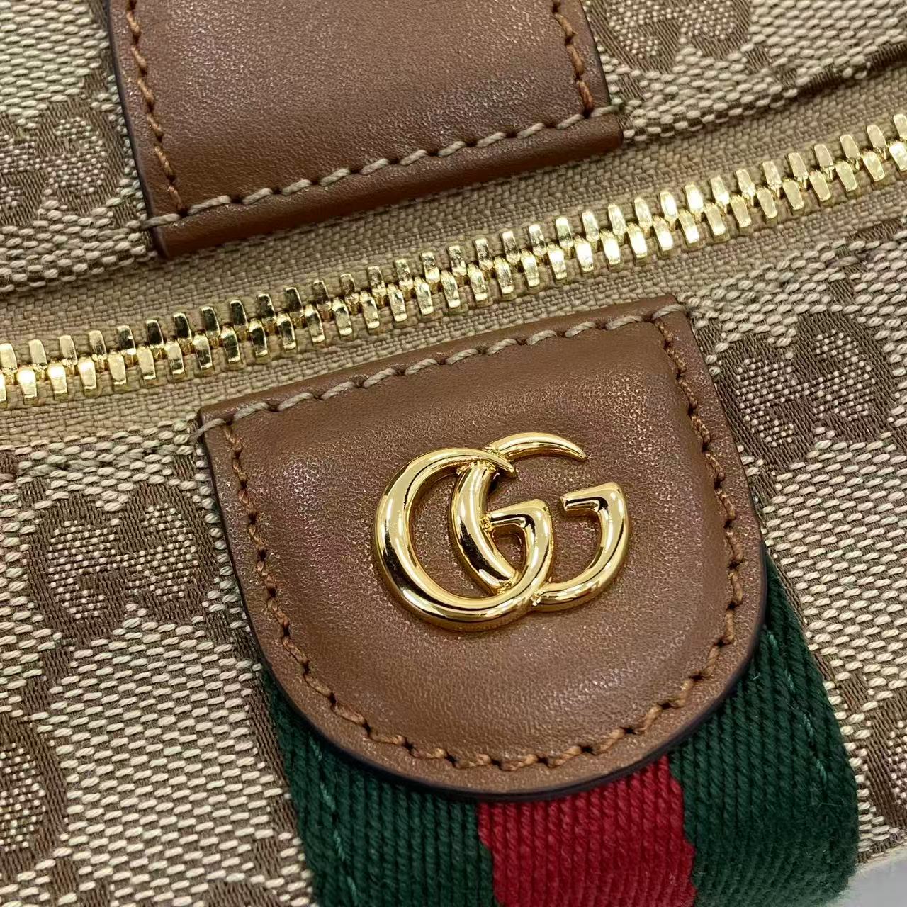 Gucci monogram bag close-up: brown leather patch with GG logo and web stripe