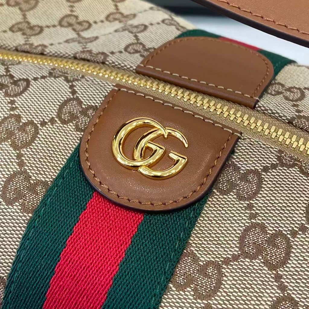 Gucci GG leather tab with gold logo on GG canvas, plus green/red web stripe