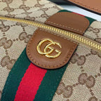 Gucci GG leather tab with gold logo on GG canvas, plus green/red web stripe
