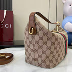 Gucci hobo bag side view with GG canvas, green/red web stripe and top handle