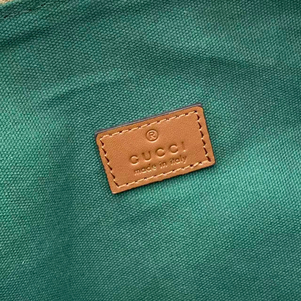 Gucci interior leather label on green fabric lining