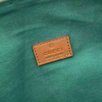 Gucci interior leather label on green fabric lining