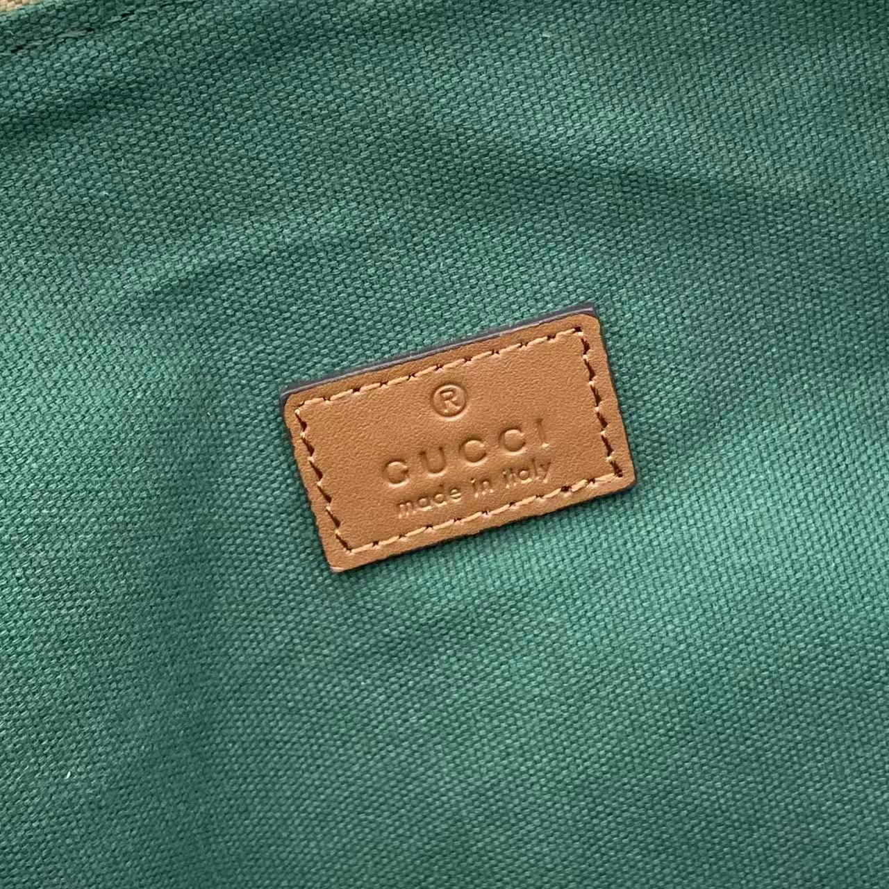 Gucci interior leather label on green fabric lining