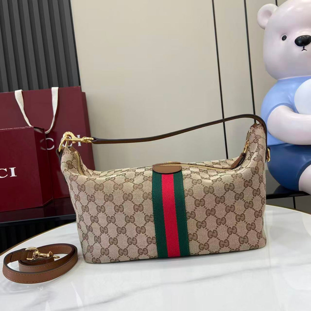 Gucci hobo bag front view with GG canvas, green and red web stripe, gold clasp