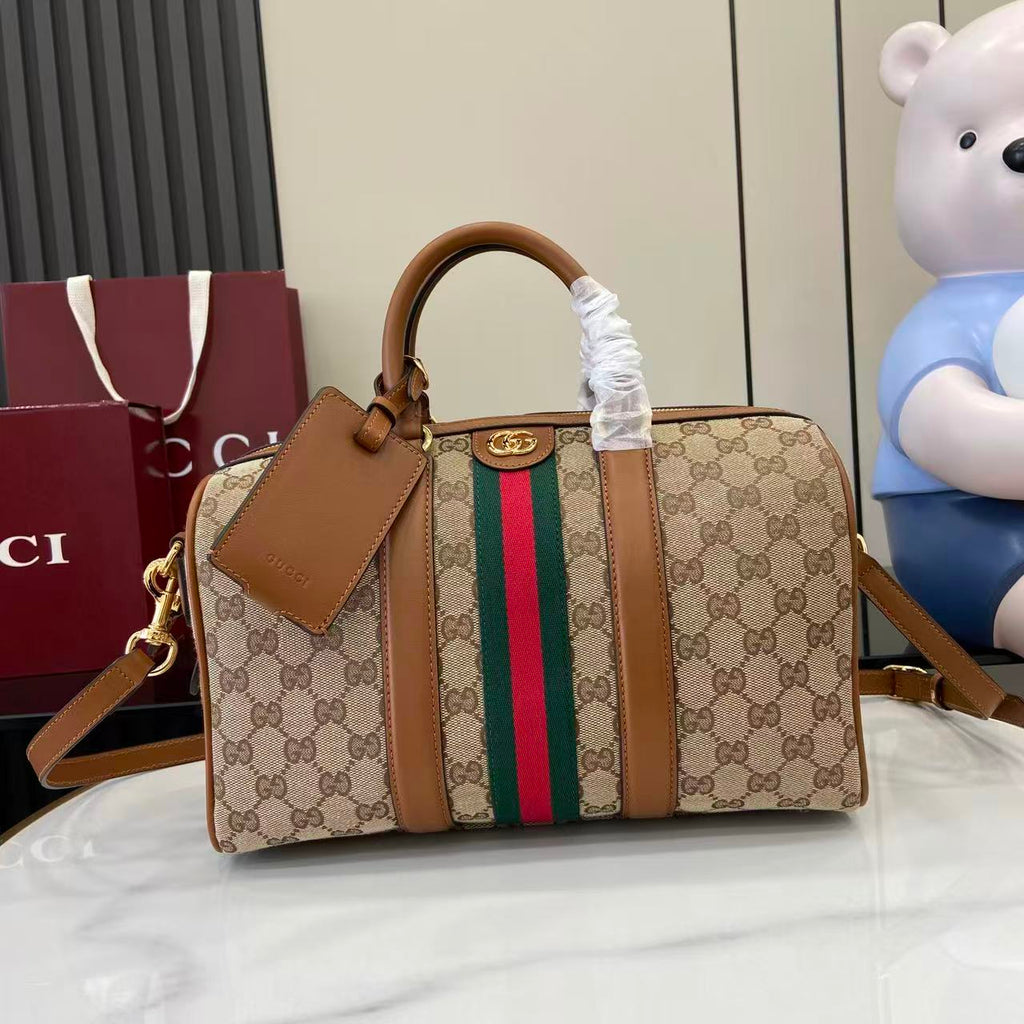 Gucci duffel bag with GG canvas, multicolor web stripe, brown leather trim, top handles