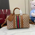 Gucci duffel bag with GG canvas, multicolor web stripe, brown leather trim, top handles