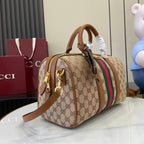 Gucci duffel bag side view with GG canvas print, green and red web stripe, leather straps