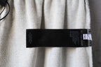 Light gray pants with black Balenciaga care label