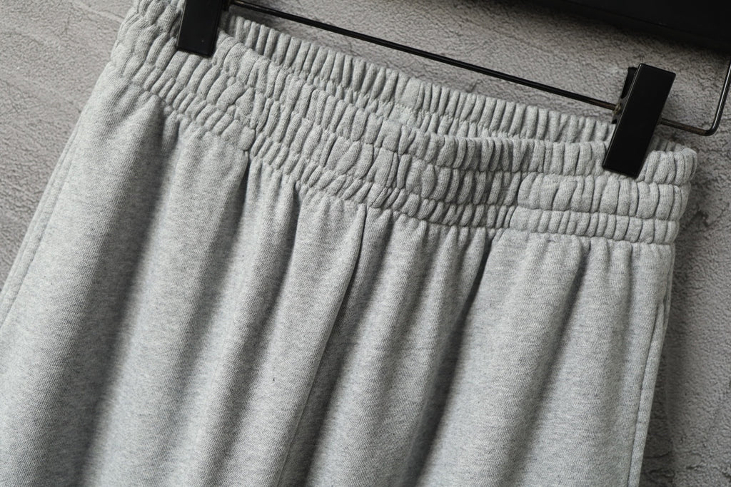 Light gray pleated front pants with elastic waistband