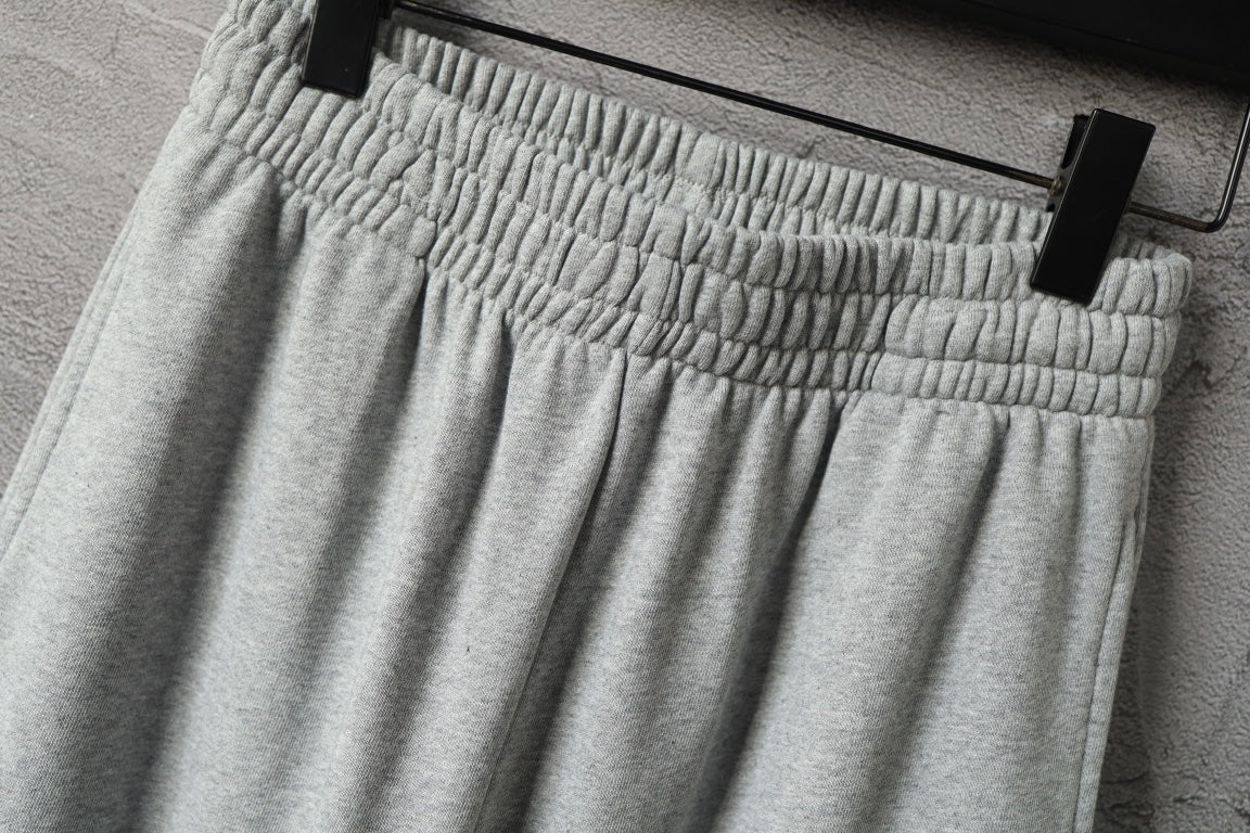 Light gray pleated front pants with elastic waistband
