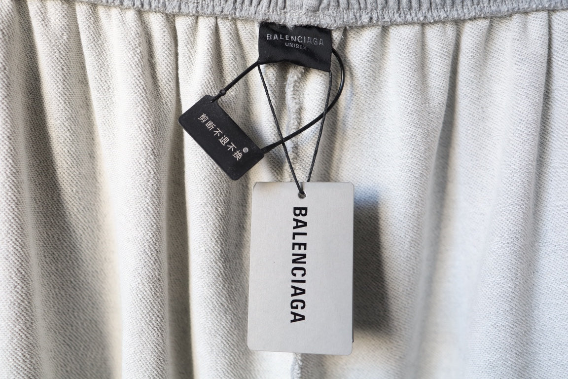 Balenciaga pants waistband with attached size tag and hang tag