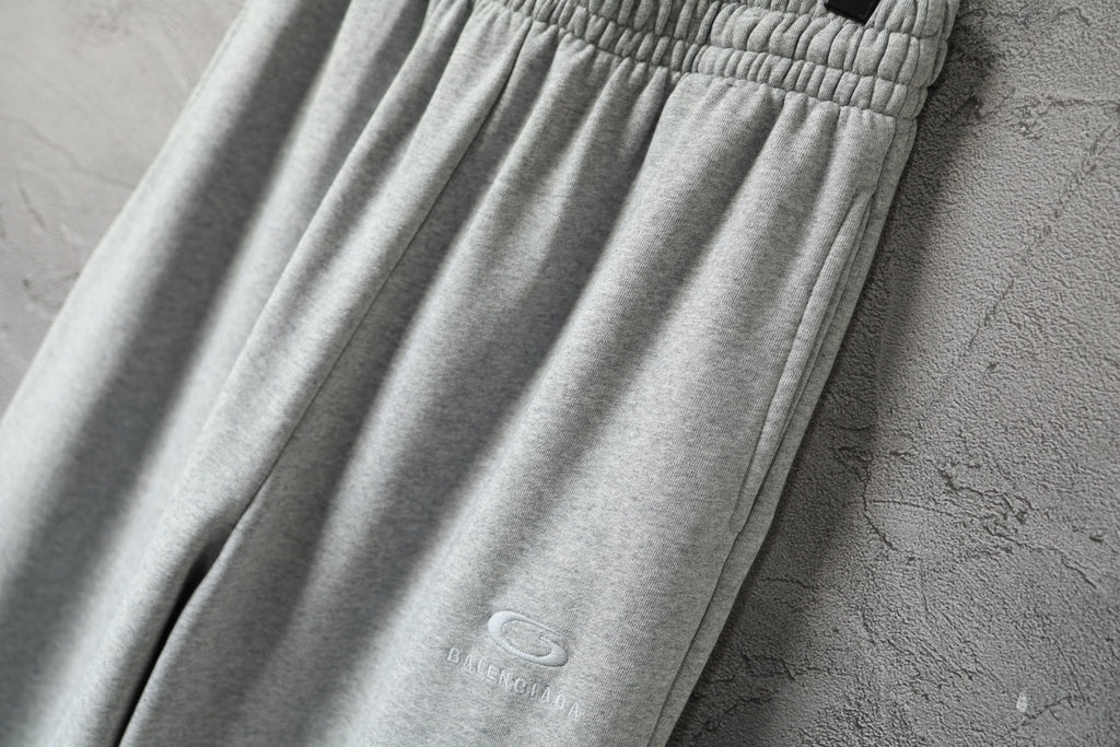 Light gray Balenciaga pants with vertical seam detail and soft drape