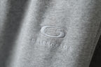 Balenciaga logo embroidery on light gray pant fabric