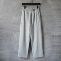 Light gray drawstring wide-leg pants with elastic waistband