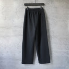 Black wide-leg pants with elastic waistband and front pleat seam detail