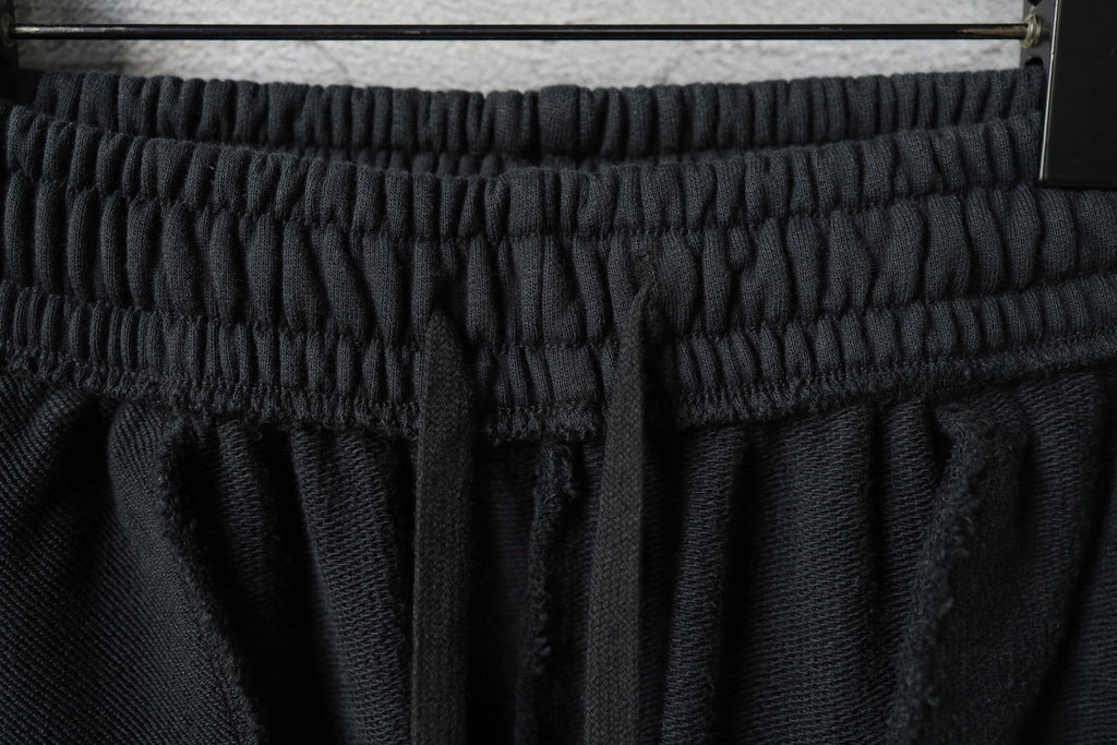 Black pants waistband with gathered elastic and structured band top